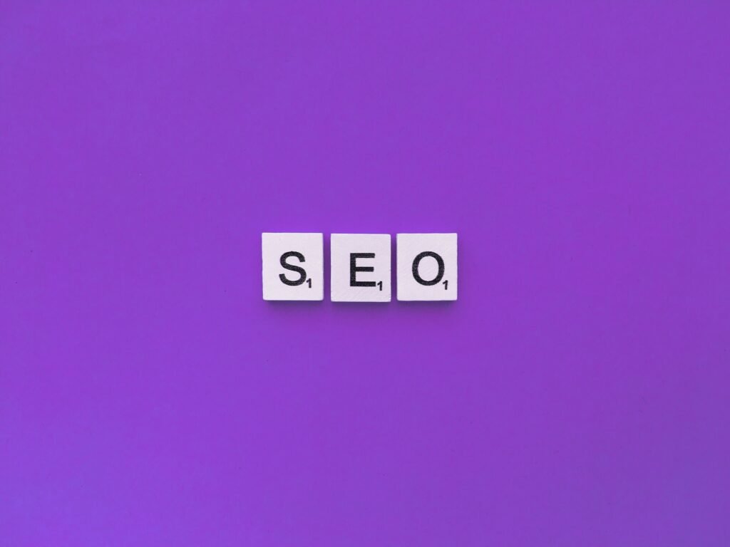SEO scrabble letters word on a violet background.